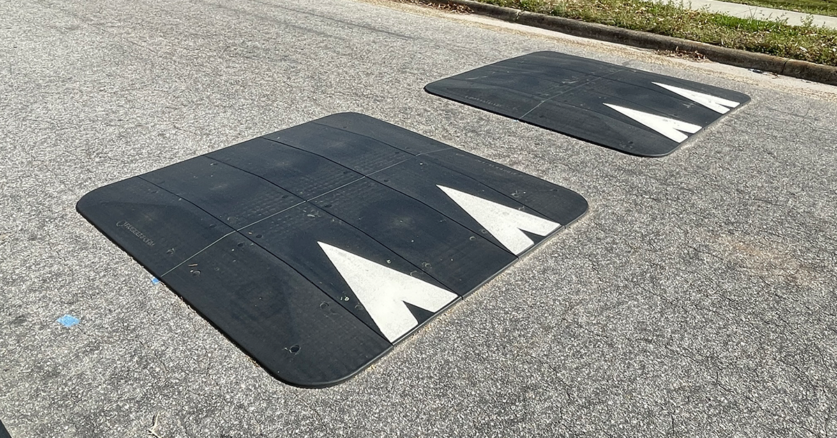 Two RubberForm speed cushions installed on a residential road